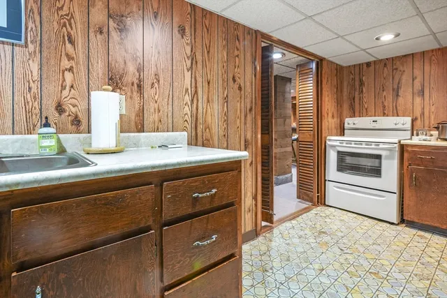 a kitchen with a stove and a refrigerator