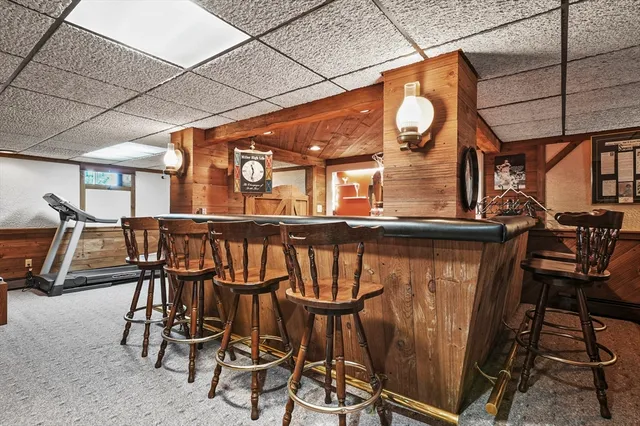 a view of a chairs and table in the back yard