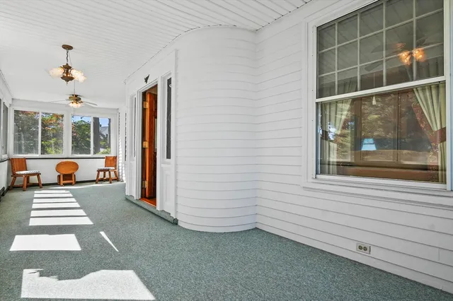a view of a hallway with windows
