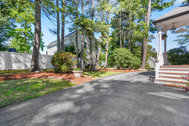 a front view of a house with a space and a garage