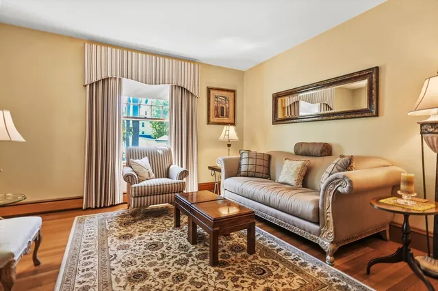 a living room with furniture and a rug