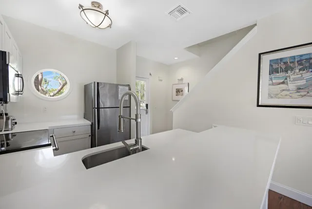 a view of a living room and chandelier