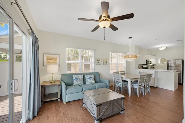 a view of living room with furniture and large window