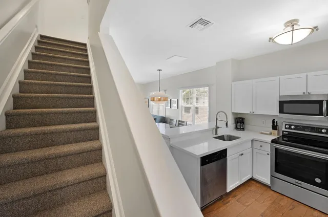a view of balcony with wooden floor and outdoor seating