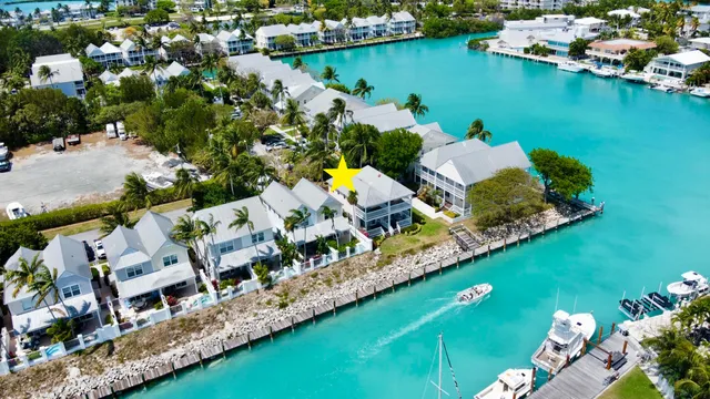 an aerial view of a house with a ocean view