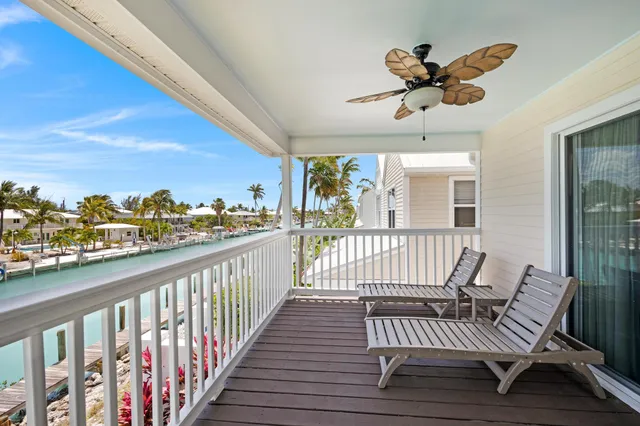 a view of a balcony with furniture
