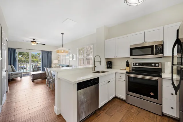 a kitchen with a stove top oven and sink