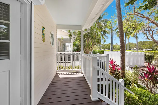 a view of a porch with wooden floor
