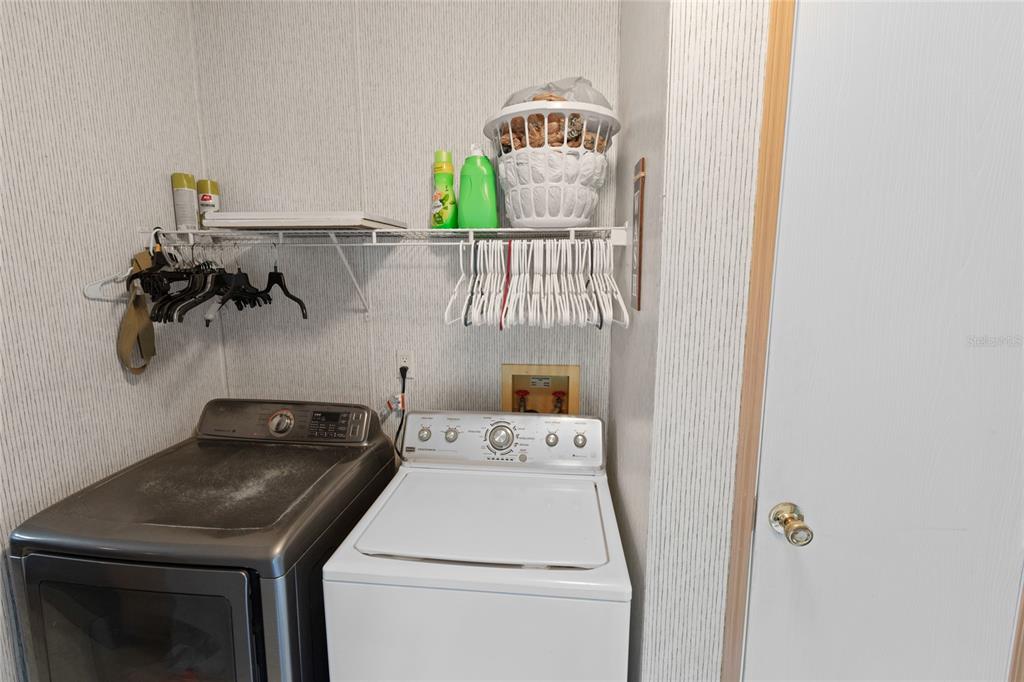 5670 Acadia Street Keystone Heights, FL 32656 - Photo 37 of 65 a utility room with dryer and washer