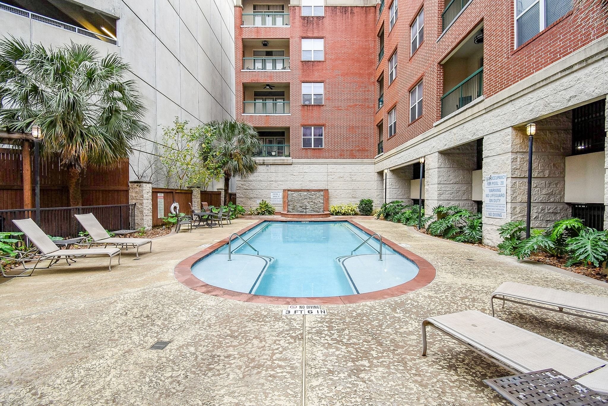 300 St Joseph Parkway, Unit 421 Houston, TX 77002 - Photo 4 of 32 a swimming pool with outdoor seating and yard