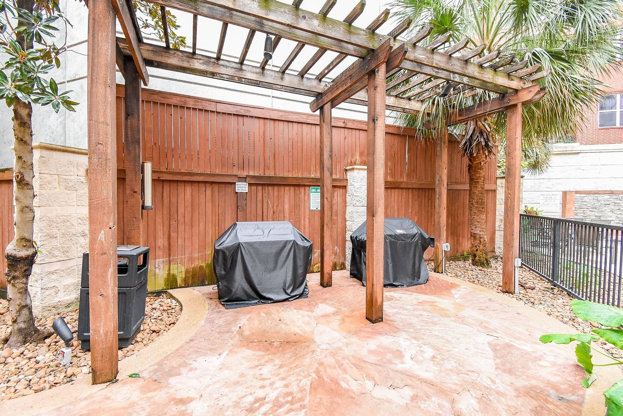 300 St Joseph Parkway, Unit 421 Houston, TX 77002 - Photo 7 of 32 a view of a patio with couches and potted plants