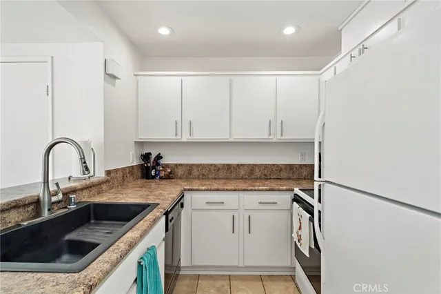 a view of a kitchen with sink and dishwasher