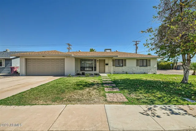 a view of a house with a garden