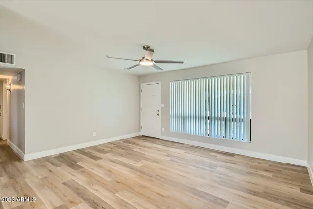 a view of an empty room with a window