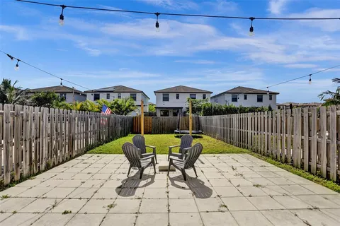 a view of a backyard with a swing