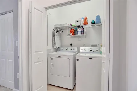 a bedroom with a bed and a mirror