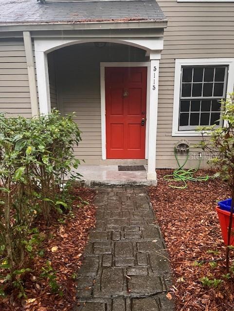 5115 Southwest 92nd Court Gainesville, FL 32608 - Photo 1 of 15 a front view of a house with a yard