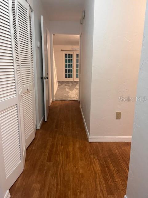 5115 Southwest 92nd Court Gainesville, FL 32608 - Photo 3 of 15 a view of a hallway with wooden floor