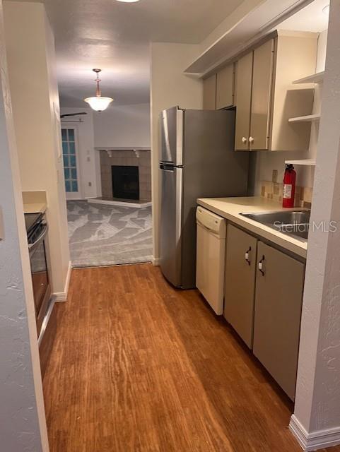 5115 Southwest 92nd Court Gainesville, FL 32608 - Photo 5 of 15 a kitchen with stainless steel appliances a refrigerator and a sink