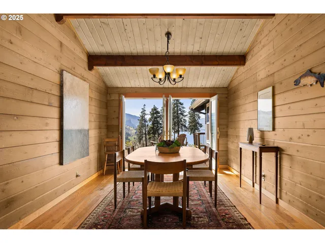 a dining room with furniture and window