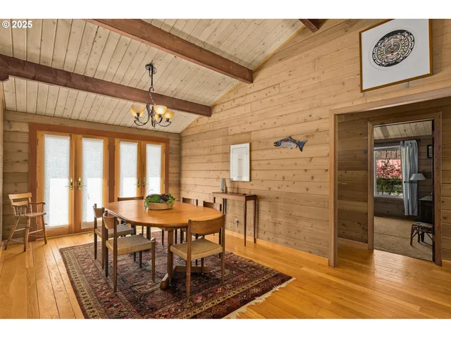 a dining room with furniture and window