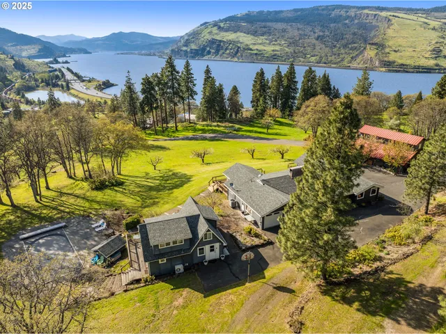a view of a swimming pool with a table and chairs