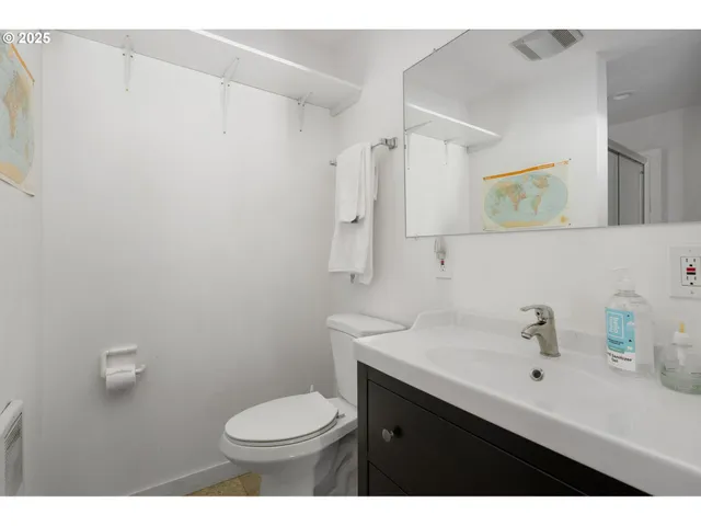 a bathroom with a sink toilet and vanity