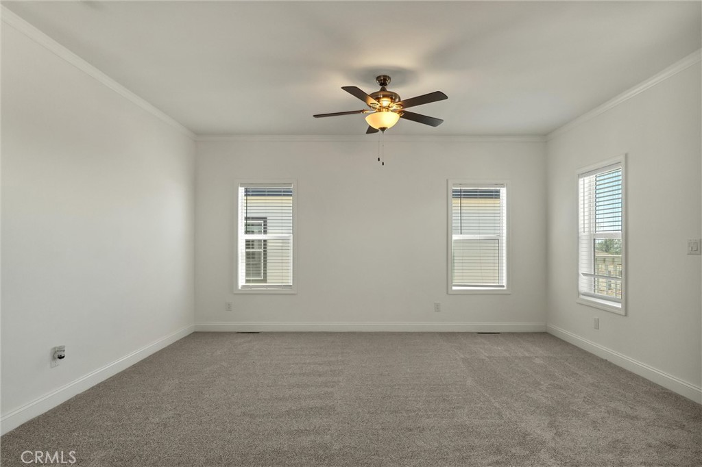 4333 Pentz Road, Unit 30 Paradise, CA 95969 - Photo 5 of 29 an empty room with windows and fan