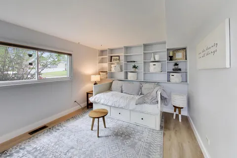 a living room with furniture and a rug