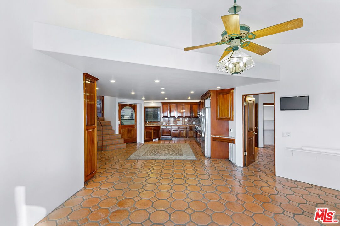 23010 Saddle Peak Road Topanga, CA 90290 - Photo 21 of 51 a view of a livingroom with furniture and a ceiling fan