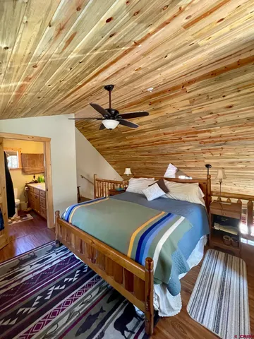 a bathroom with a shower toilet and sink