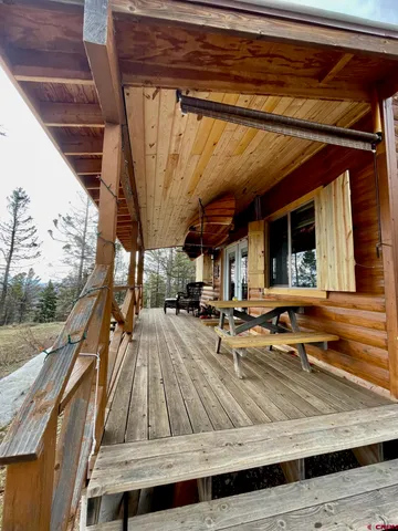 a view of a backyard with sitting area