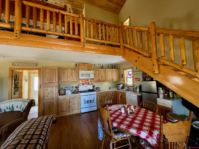 a view of a dining room with furniture