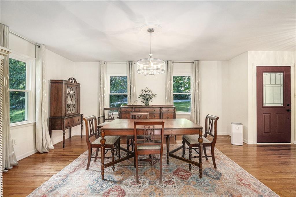 2545 Rockbridge Road Northwest Conyers, GA 30012 - Photo 12 of 61 a view of a dining room with furniture window and wooden floor