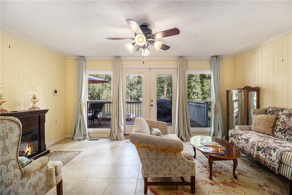 2545 Rockbridge Road Northwest Conyers, GA 30012 - Photo 13 of 61 a bedroom with furniture and large windows