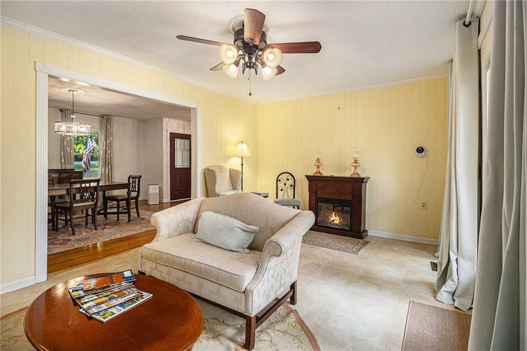 2545 Rockbridge Road Northwest Conyers, GA 30012 - Photo 14 of 61 a living room with furniture and a chandelier
