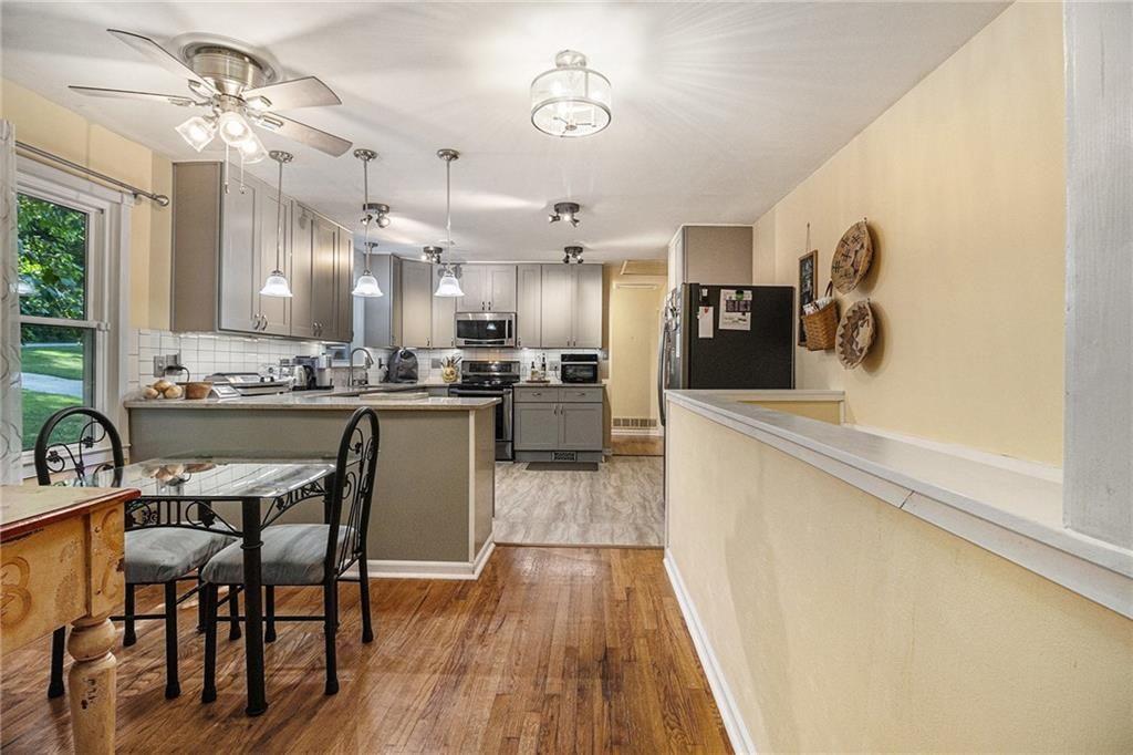 2545 Rockbridge Road Northwest Conyers, GA 30012 - Photo 17 of 61 a kitchen with a table and chairs