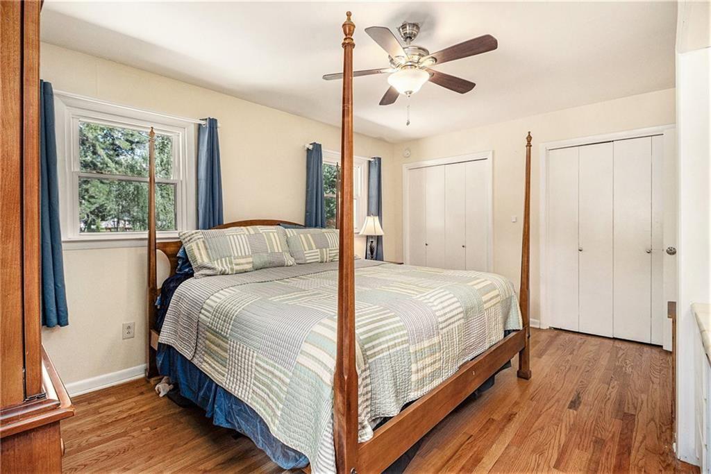 2545 Rockbridge Road Northwest Conyers, GA 30012 - Photo 24 of 61 a bedroom with a bed and a ceiling fan