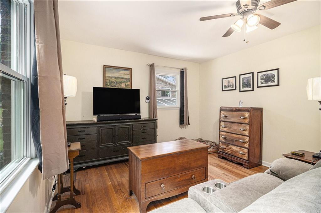 2545 Rockbridge Road Northwest Conyers, GA 30012 - Photo 29 of 61 a living room with furniture and a flat screen tv