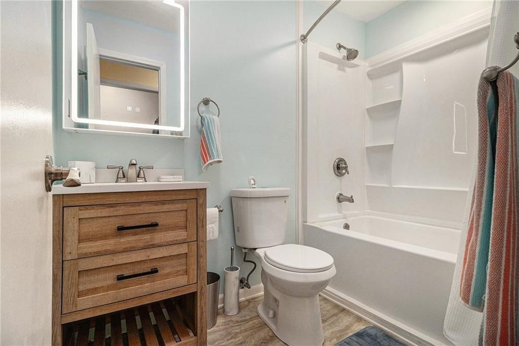 2545 Rockbridge Road Northwest Conyers, GA 30012 - Photo 39 of 61 a bathroom with a sink toilet and shower