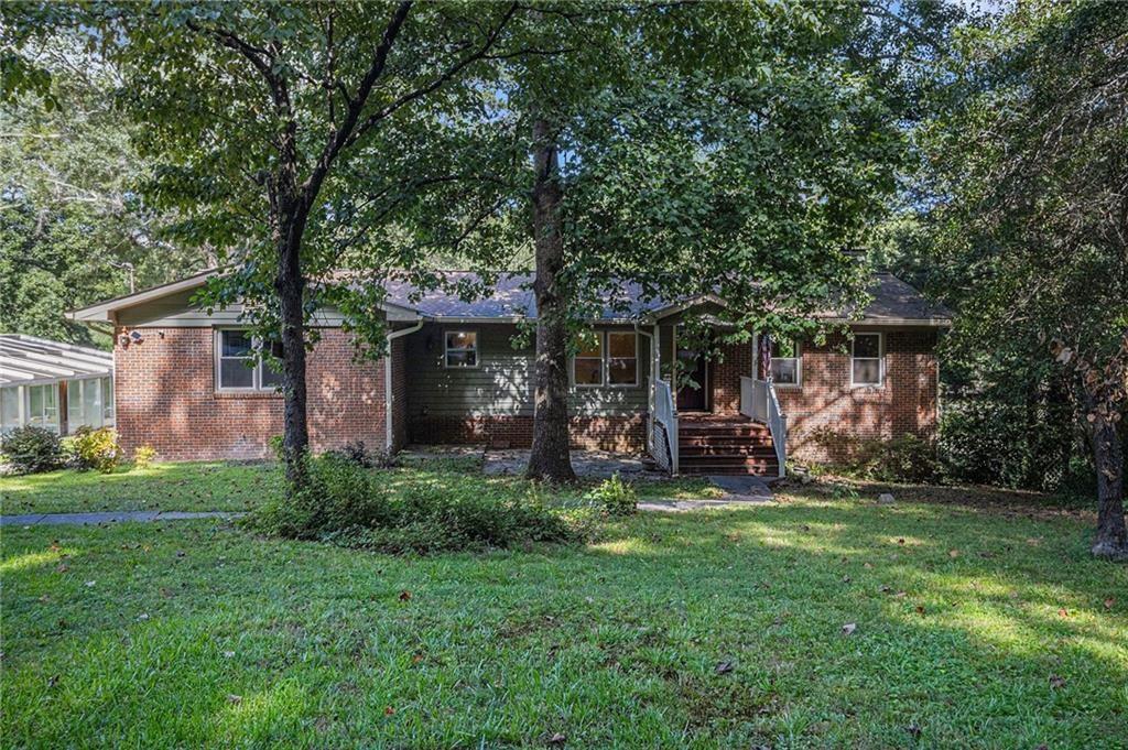 2545 Rockbridge Road Northwest Conyers, GA 30012 - Photo 4 of 61 a view of a house with backyard porch and garden