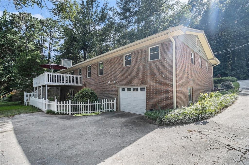 2545 Rockbridge Road Northwest Conyers, GA 30012 - Photo 45 of 61 a view of a house with a yard and large tree