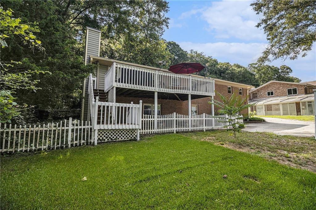 2545 Rockbridge Road Northwest Conyers, GA 30012 - Photo 46 of 61 a view of a house with backyard and porch