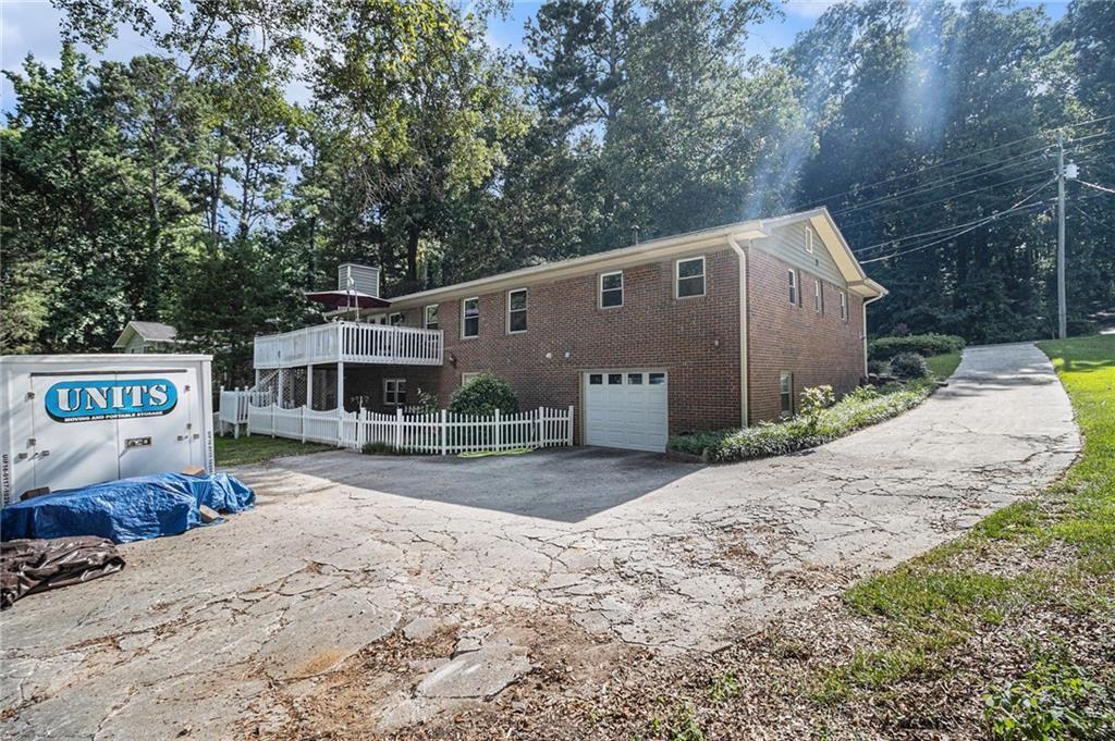 2545 Rockbridge Road Northwest Conyers, GA 30012 - Photo 47 of 61 a front view of a house with a yard and garage