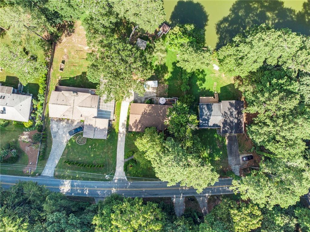 2545 Rockbridge Road Northwest Conyers, GA 30012 - Photo 51 of 61 an aerial view of residential house with outdoor space and trees all around