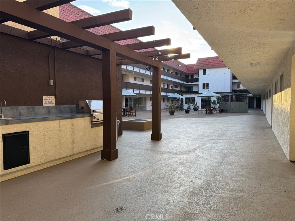 3939 East Allin, Unit 109 Long Beach, CA 90803 - Photo 14 of 21 a view of a kitchen with furniture and a kitchen