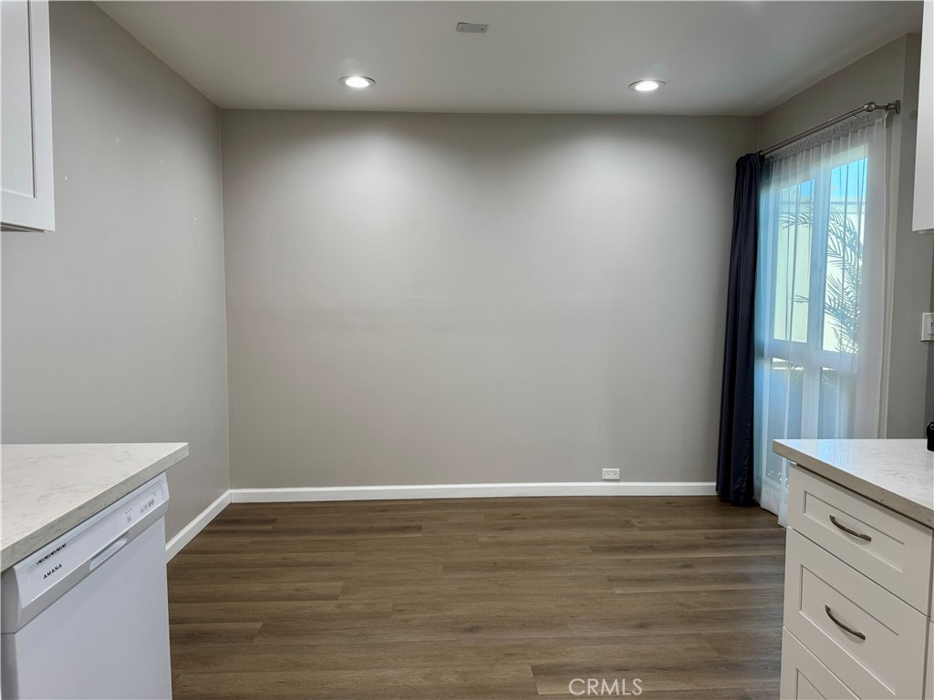 3939 East Allin, Unit 109 Long Beach, CA 90803 - Photo 2 of 21 a view of room with window and wooden floor