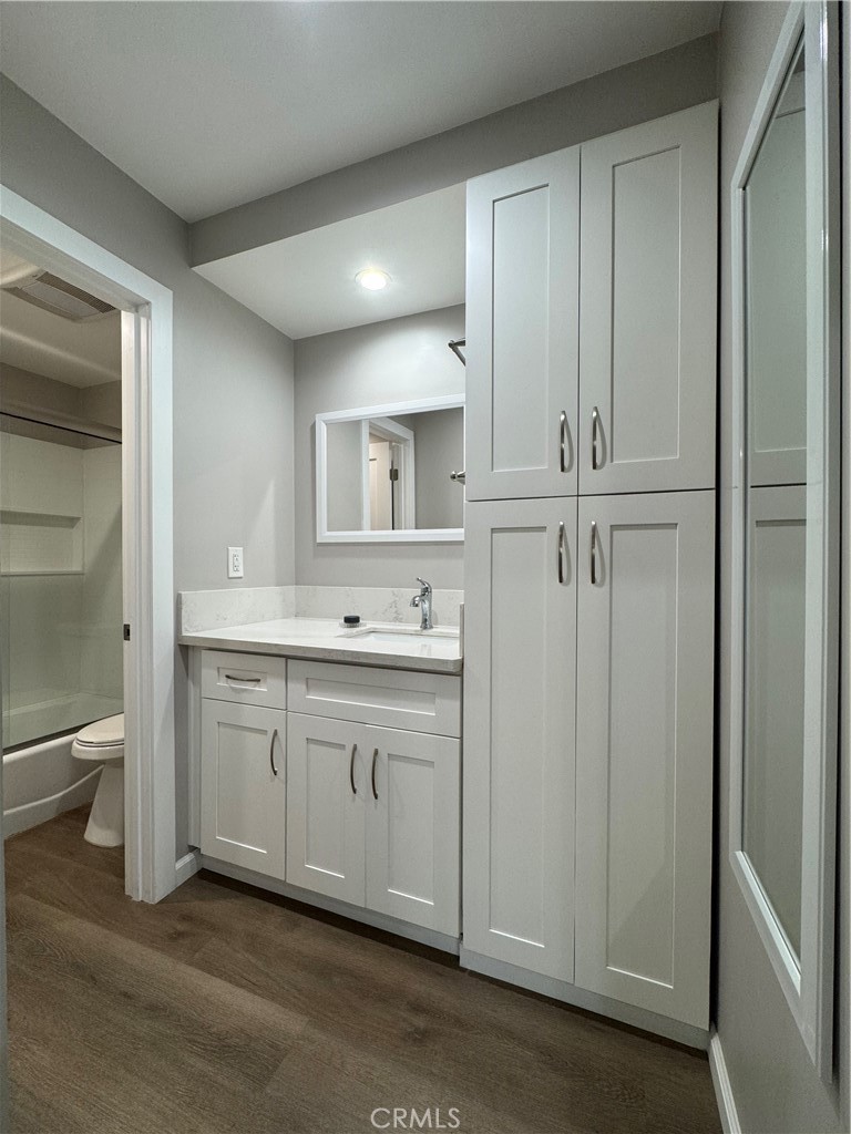 3939 East Allin, Unit 109 Long Beach, CA 90803 - Photo 6 of 21 a spacious bathroom with a shower a sink and a toilet