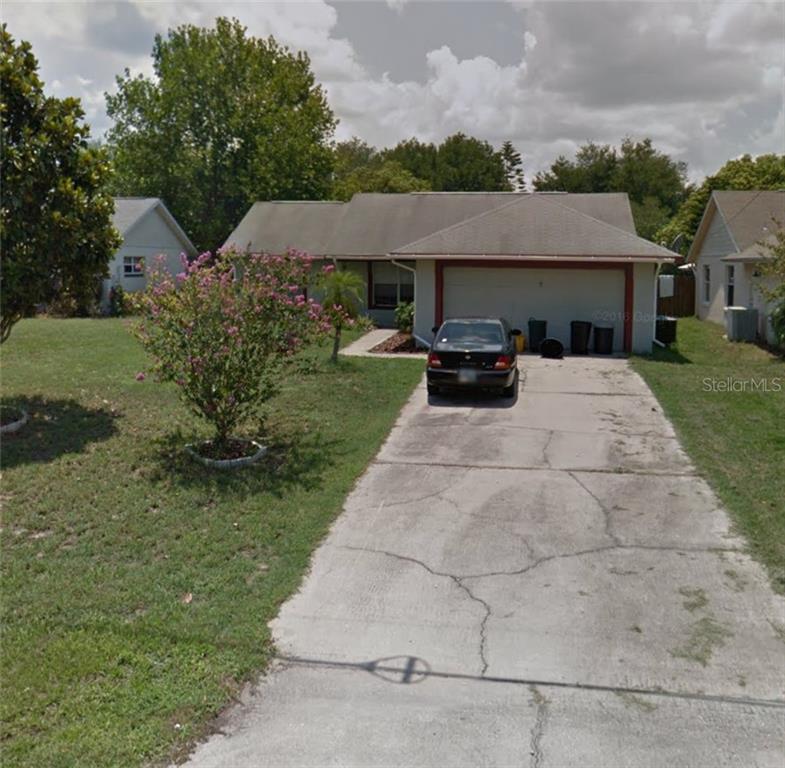 11730 Oswalt Road Clermont, FL 34711 - Photo 1 of 1 a front view of house with yard and green space