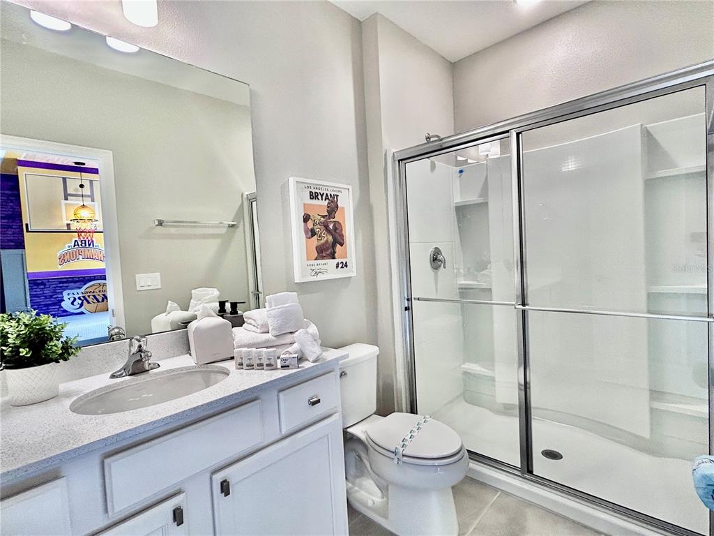 6271 Sand Skipper Road Orlando, FL 32821 - Photo 34 of 46 a bathroom with a sink toilet and shower